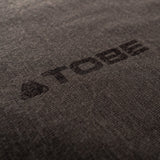 Printed TOBE Logo on base layer pant leg.